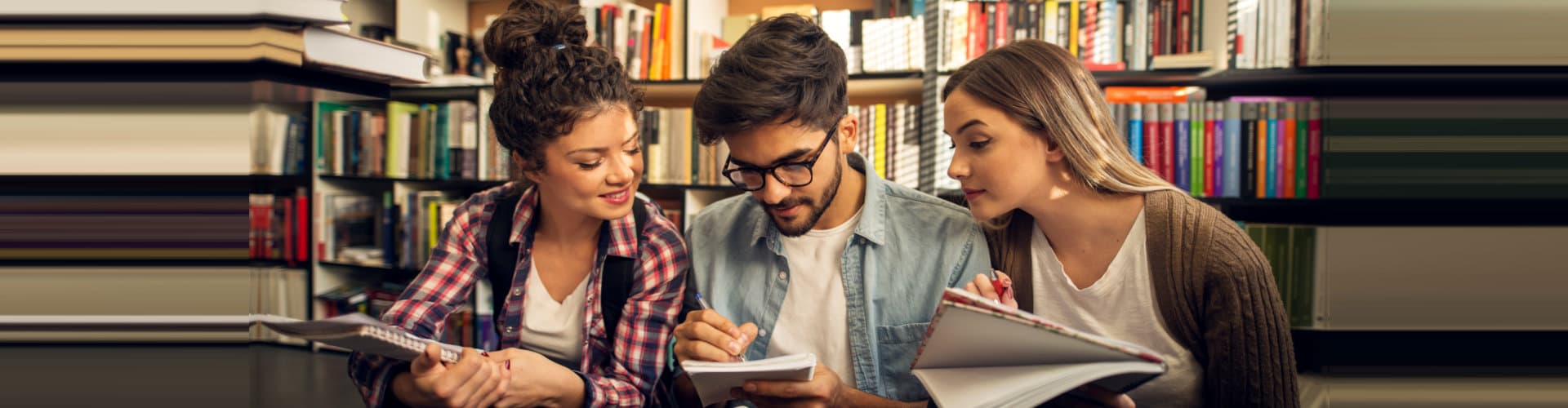 three people studying