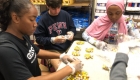 Group of people sorting some food